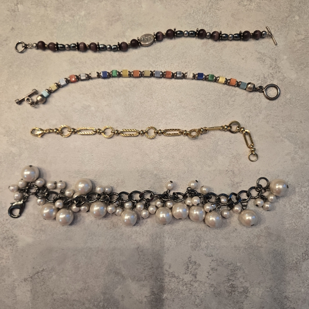 4 pretty bracelets. Great condition.